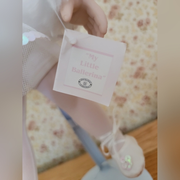 Charming Porcelain Doll with Lace Details and Rosy Cheeks - Picture 5 of 5